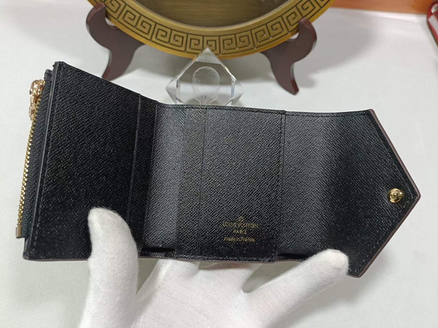 Leather wallet being held in hand