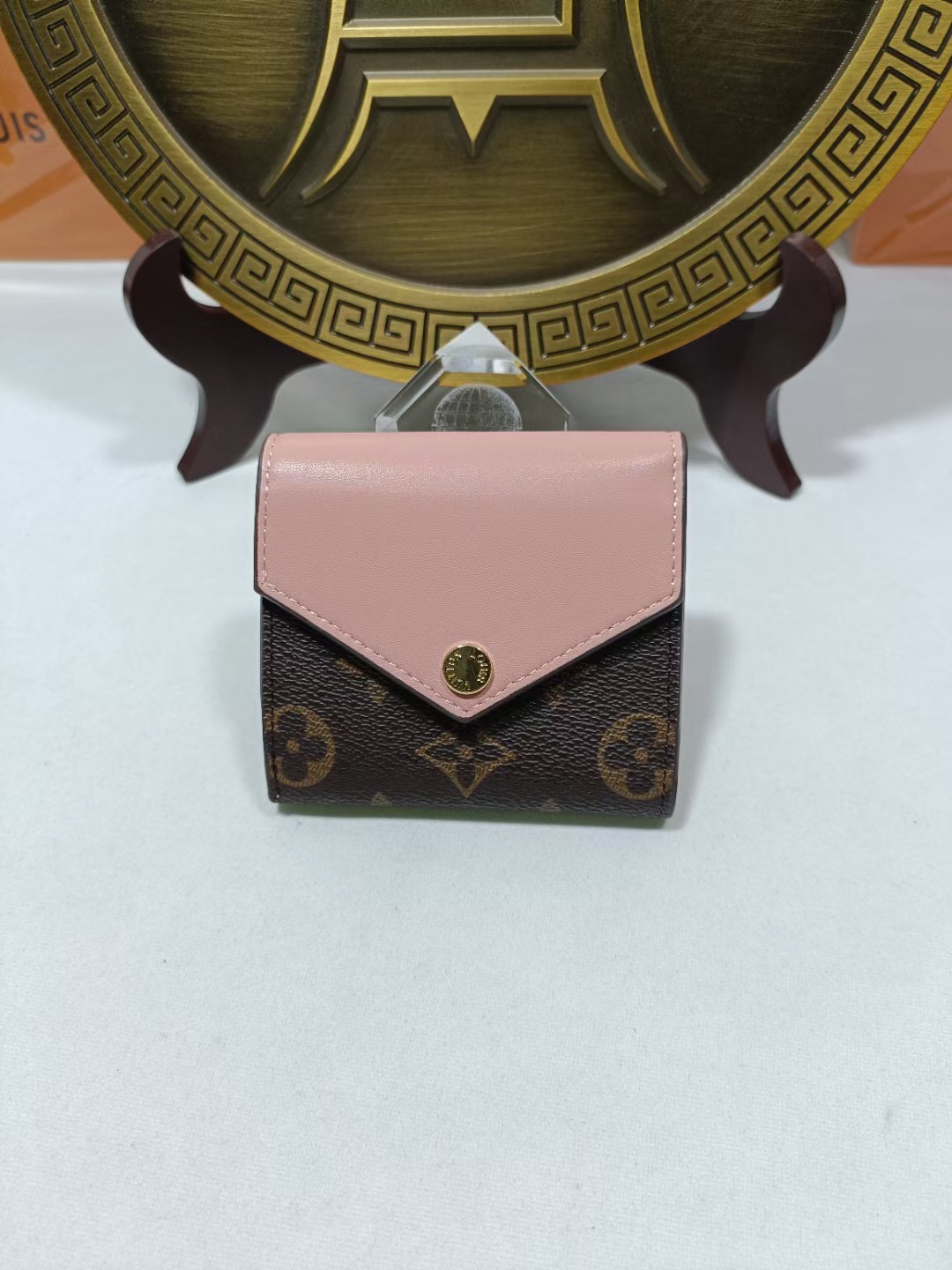 Genuine leather bifold wallet, front view, showing texture