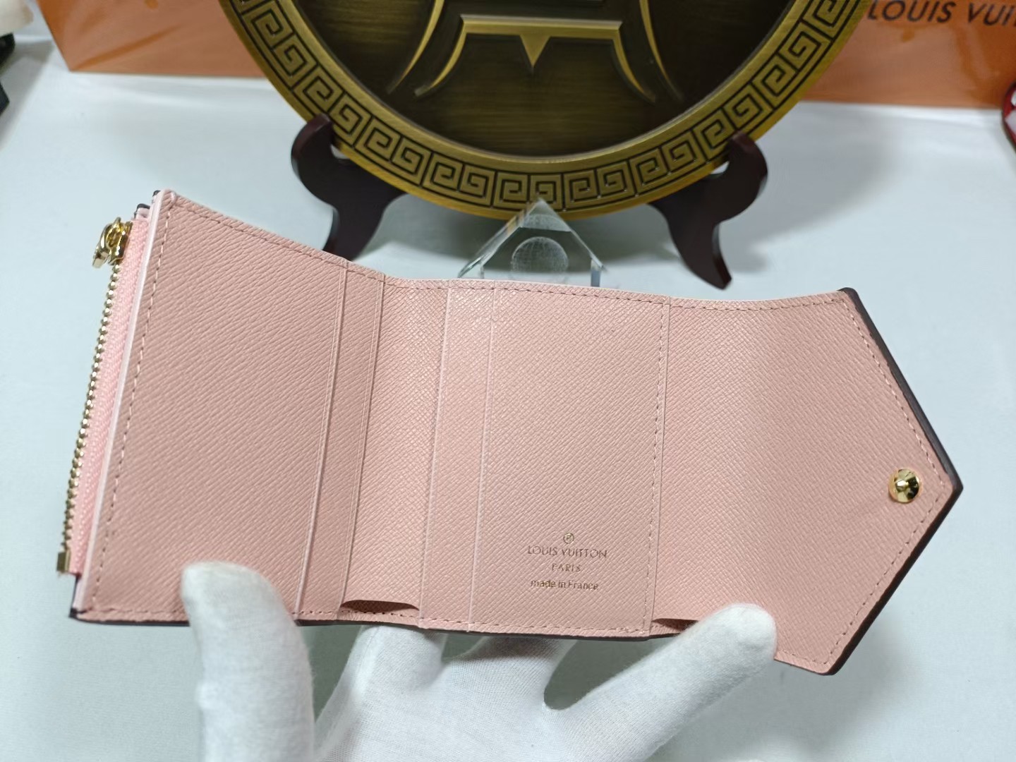 Leather wallet being held in hand