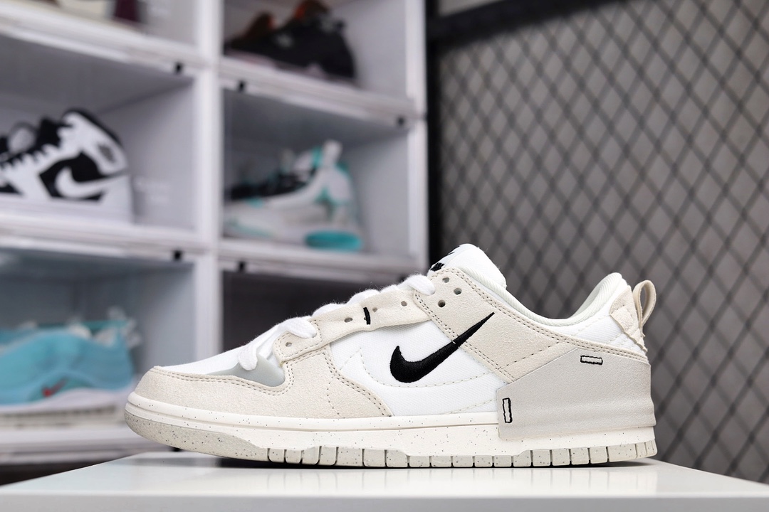 H5 纯原版本 Nike Dunk Low Disrupt 2 灰白色 权威制造无正品不开发正品同步还原 全面电脑针车 正品档案数据精准打造原纸板楦头 私模大底 一针一线遵循原版原厂材质1:1同步定制 拒绝偷工减料过验级细节 天花板货品独家呈现内侧的 Nike Swoosh 采用缝线勾勒出轮廓，最亮眼的设计莫过于外侧的小型 Swoosh 使用黑色刺绣制作而成，在稳重的同时又不失俏皮可爱。后跟周围使用帆布材质做半包露出一半的橡胶中底，融入摩登感觉，为经久不衰的设计增添了新的亮点