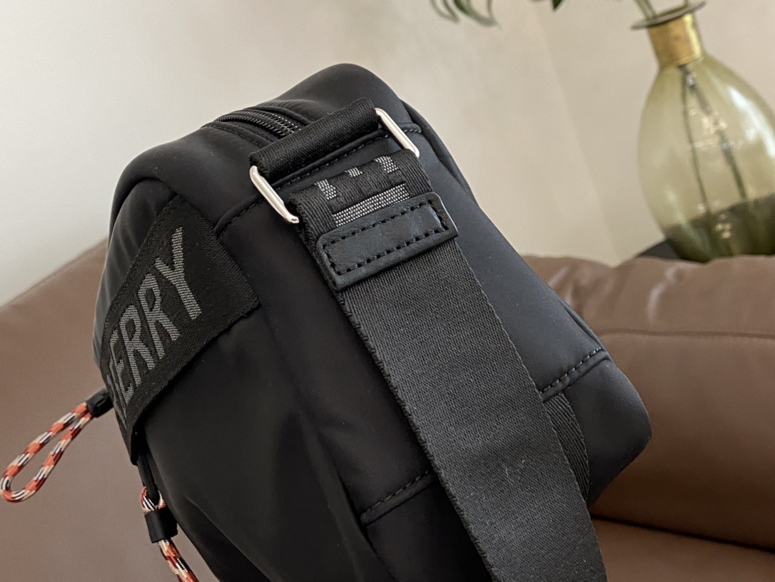Camera bag silhouette featuring prominent Burberry lettering across the - Comprehensive 3