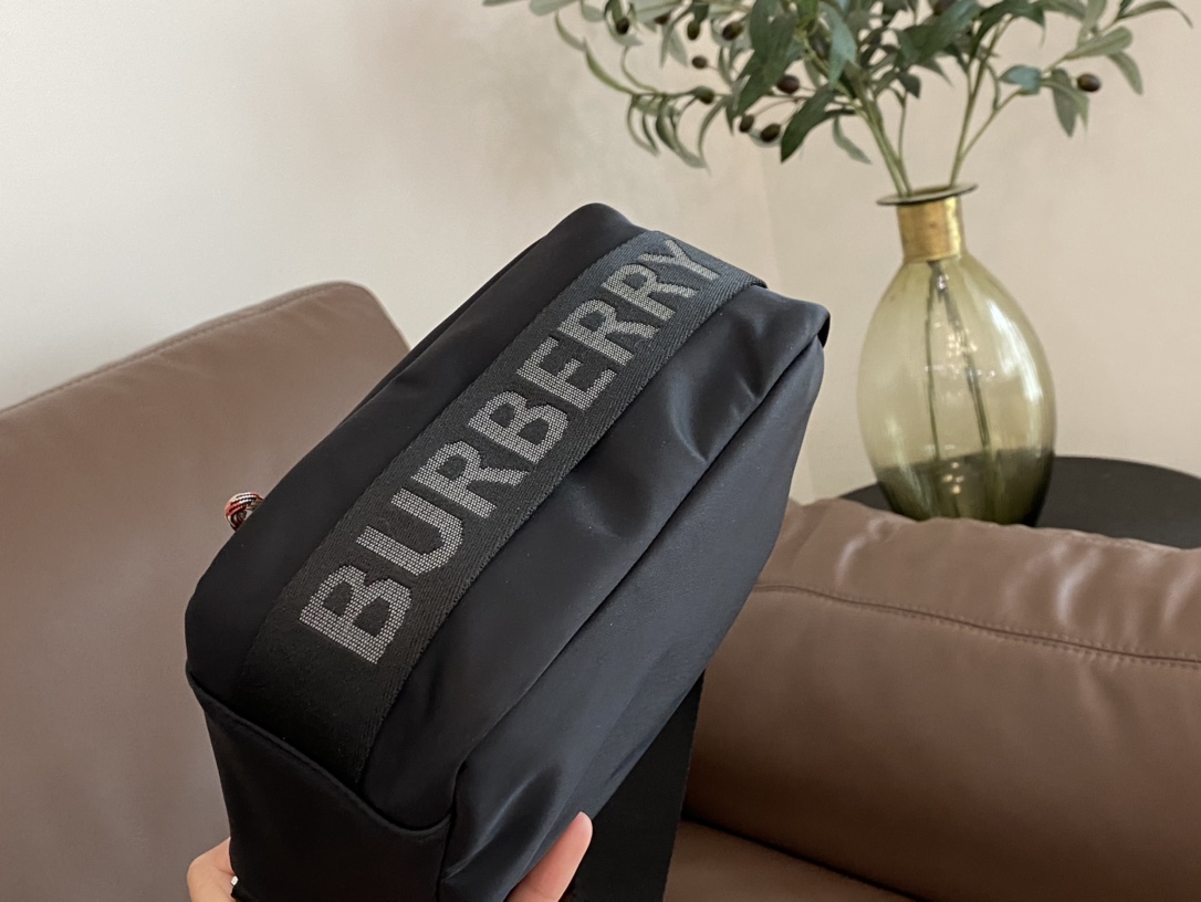 Camera bag silhouette featuring prominent Burberry lettering across the - Comprehensive 4