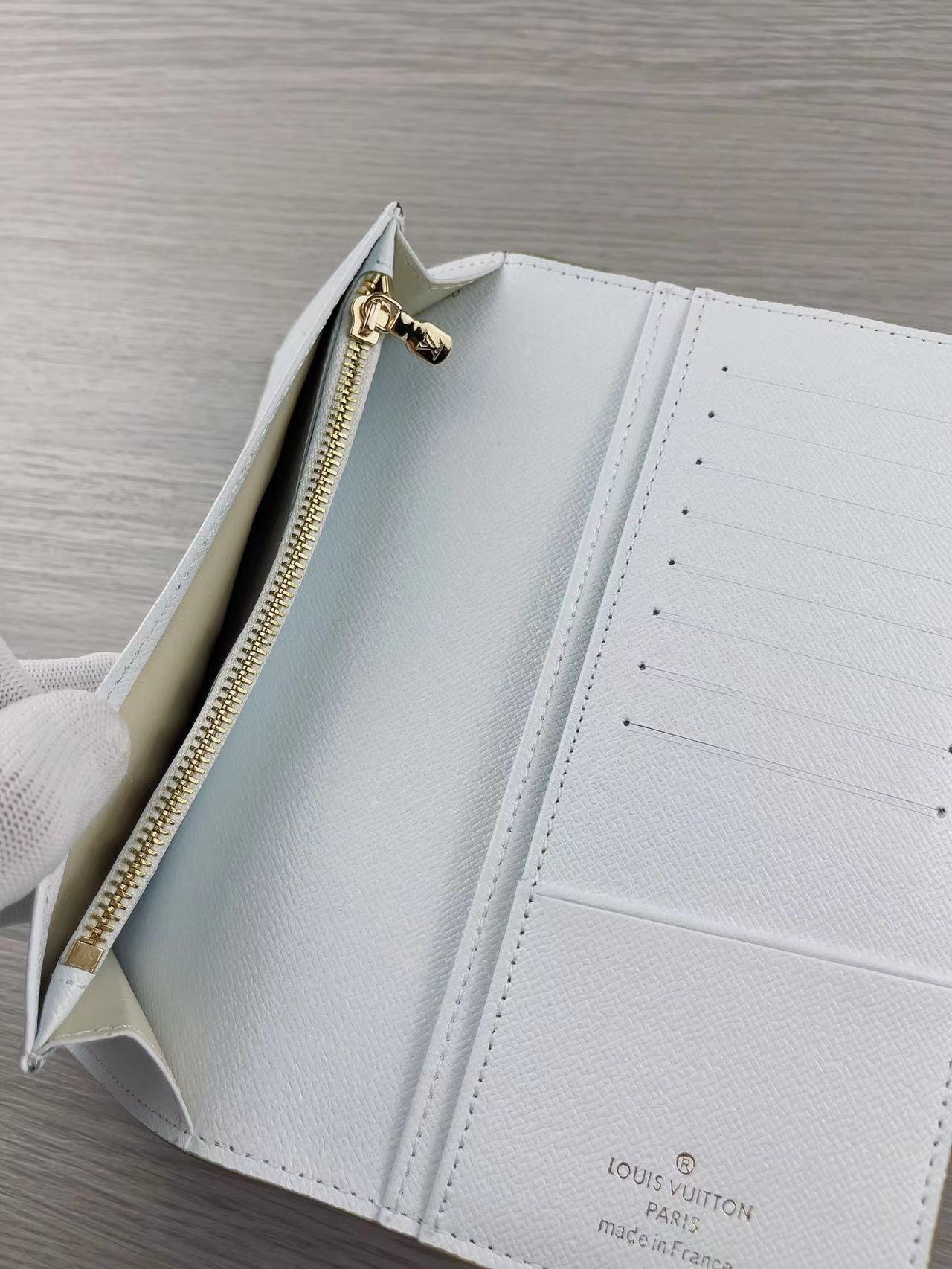 Assortment of different colors of leather bifold wallets