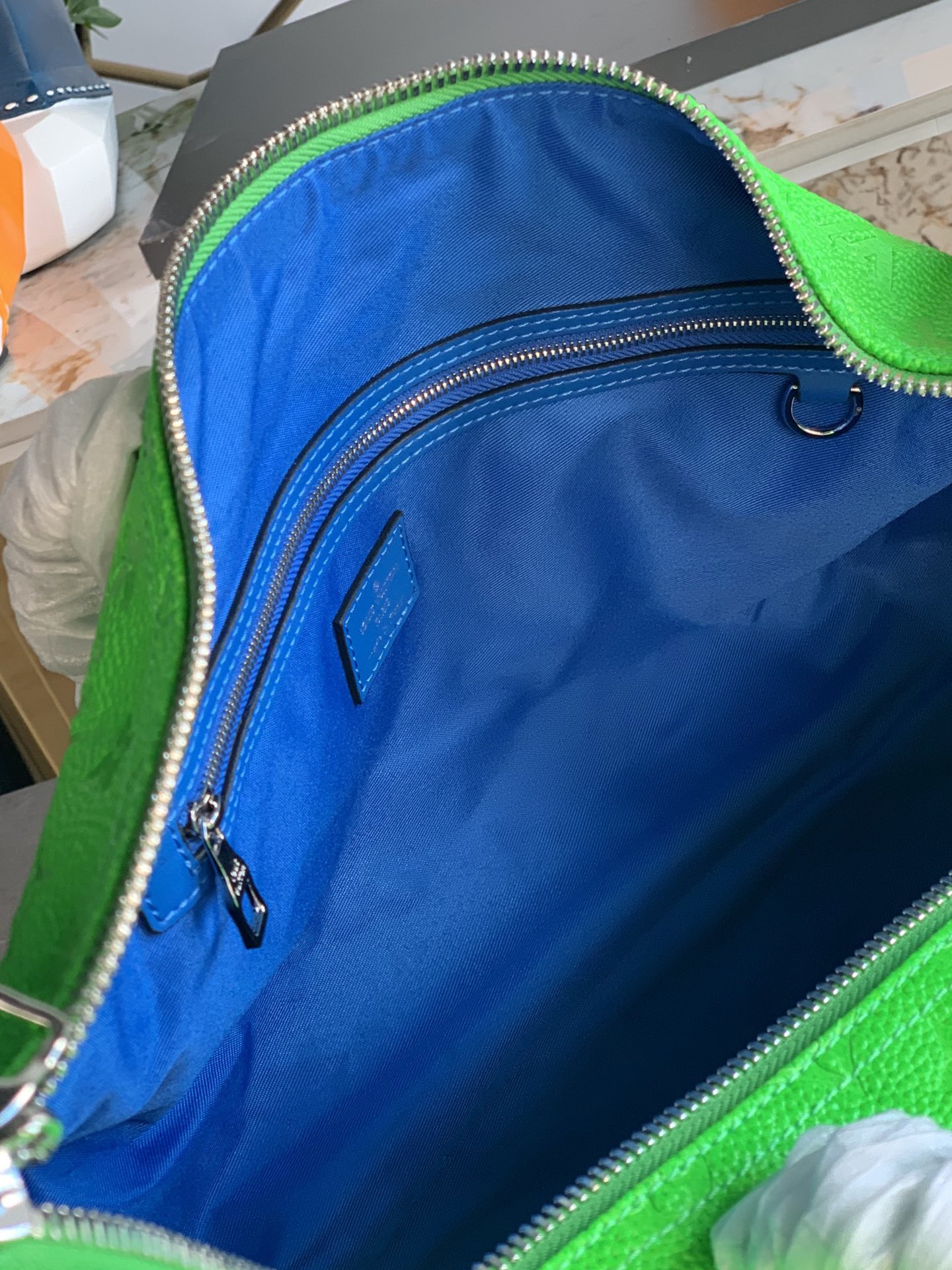 this Keepall Bandoulière 50 travel bag features American artist Lawrence - Bag 8