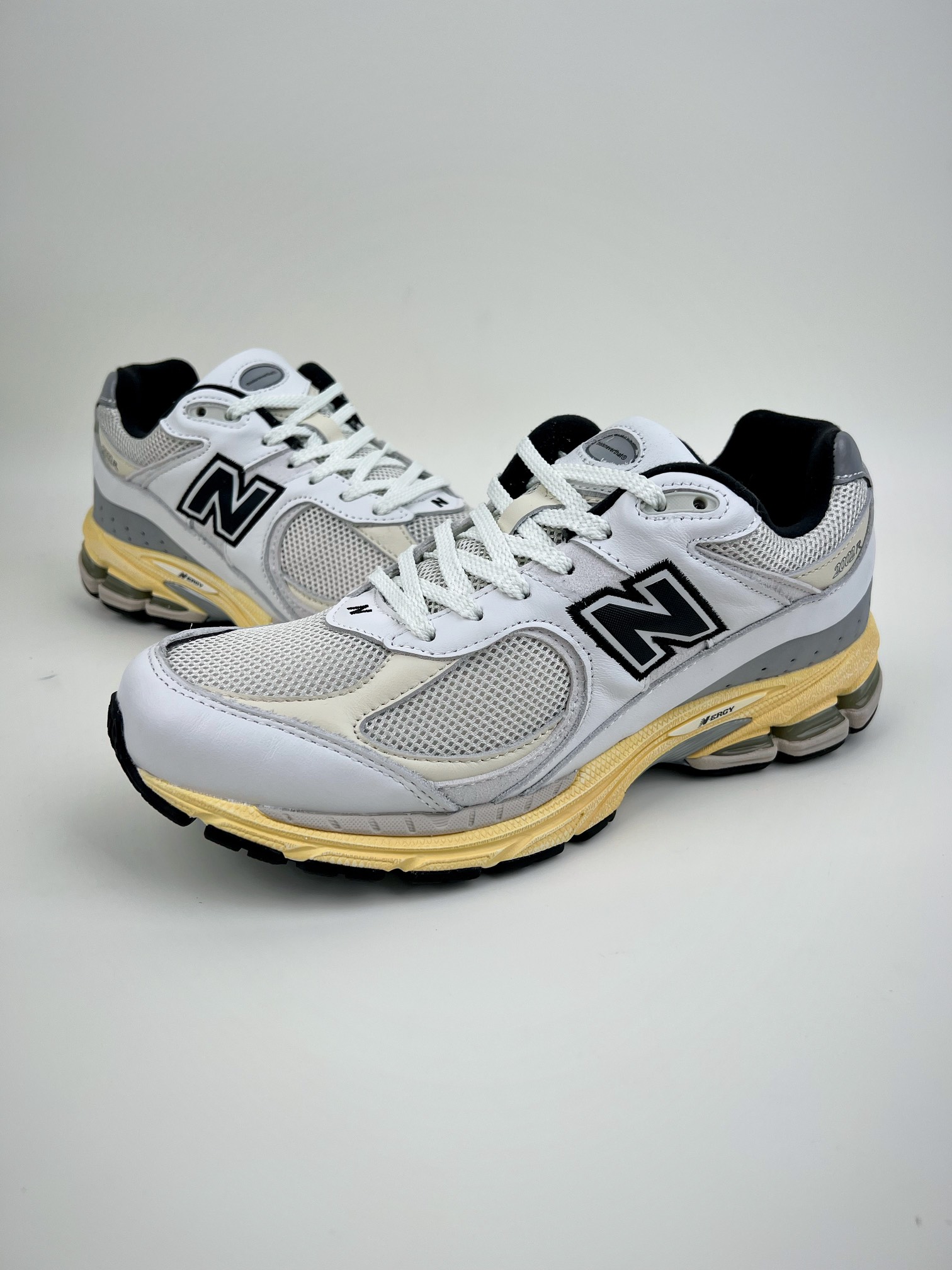 New Balance white and yellow 2002 series retro casual running shoes ML2002RT