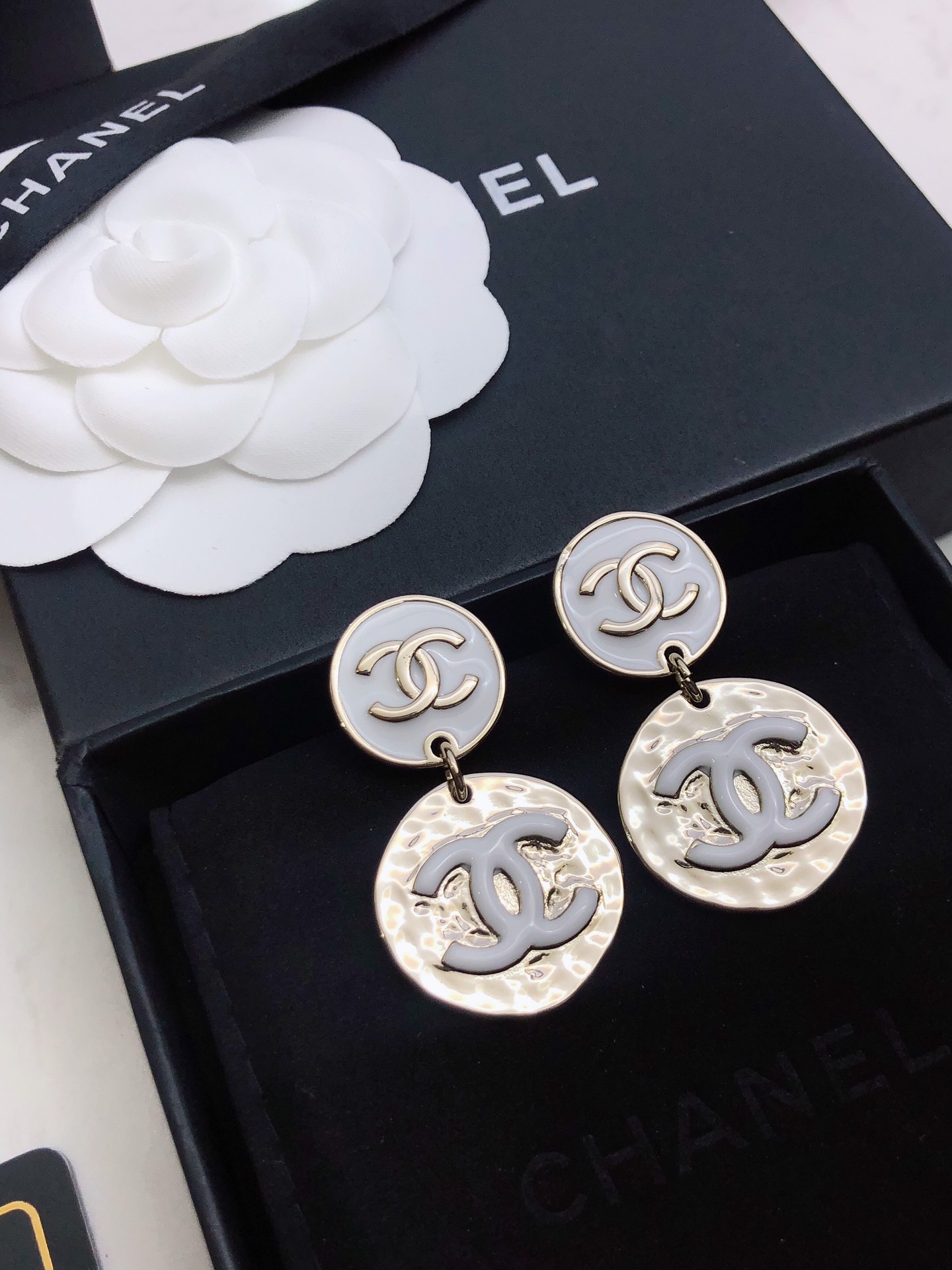chanel silver round medallion earrings