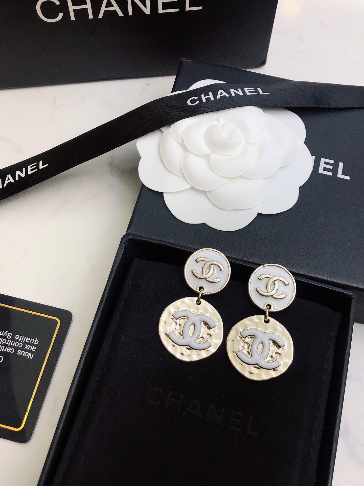 chanel silver round medallion earrings