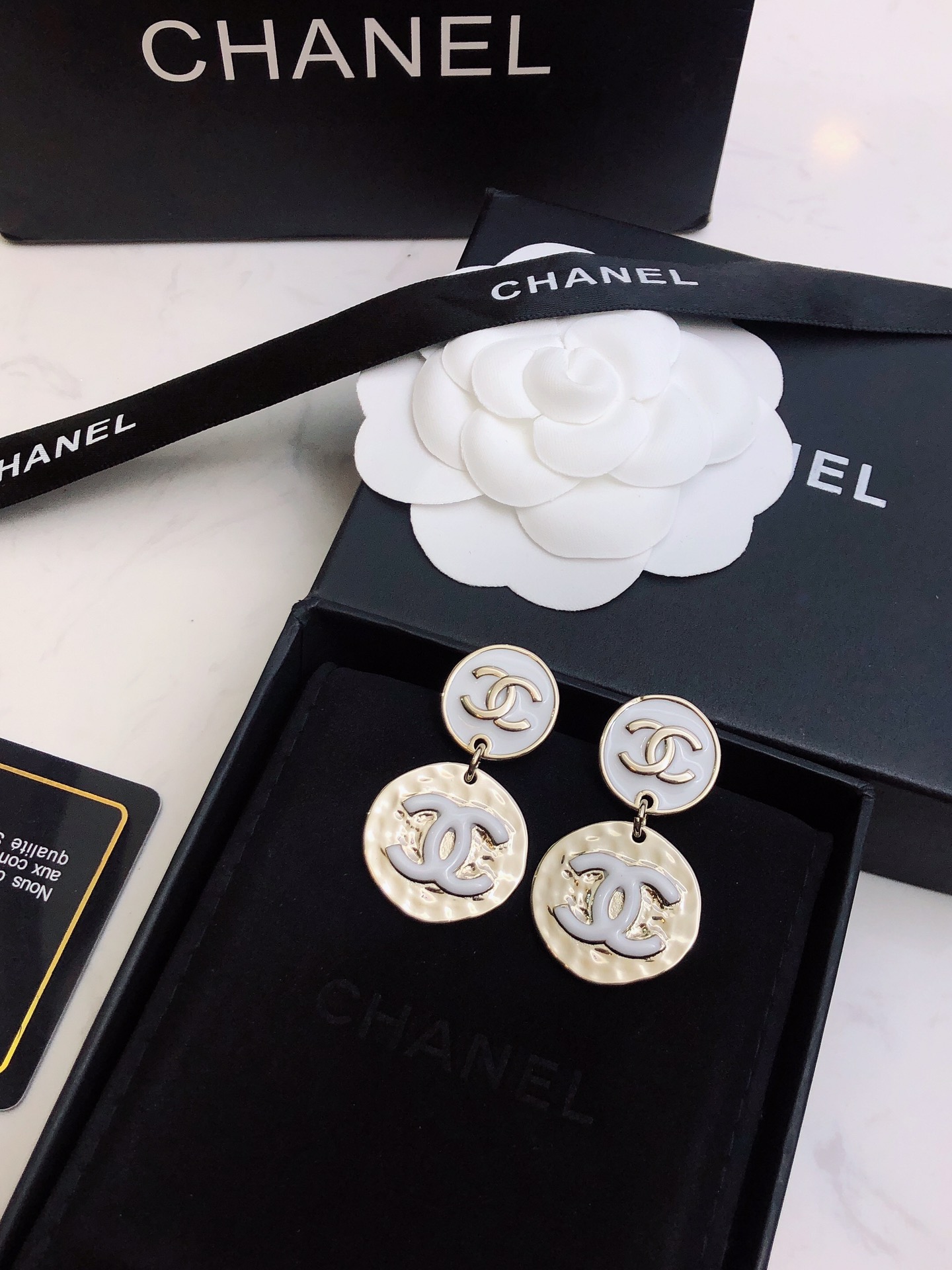 chanel silver round medallion earrings