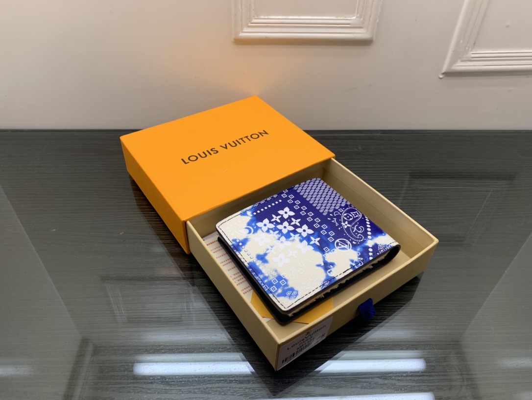 Open leather bifold wallet with cards in slots