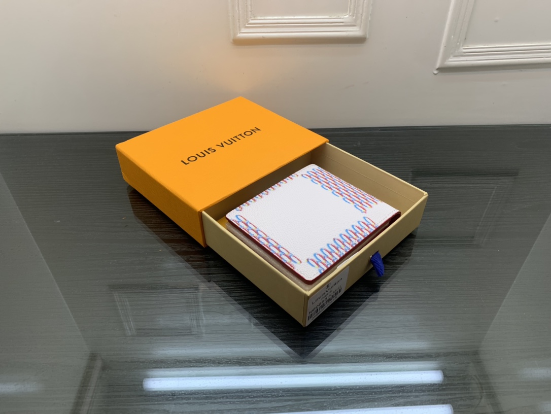 Open view of a leather bifold wallet showing card slots