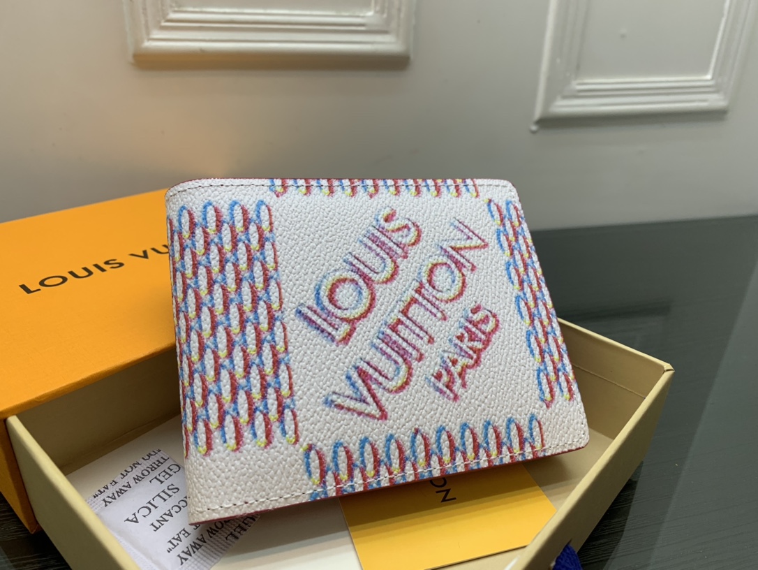 Leather bifold wallet next to a hand for size comparison