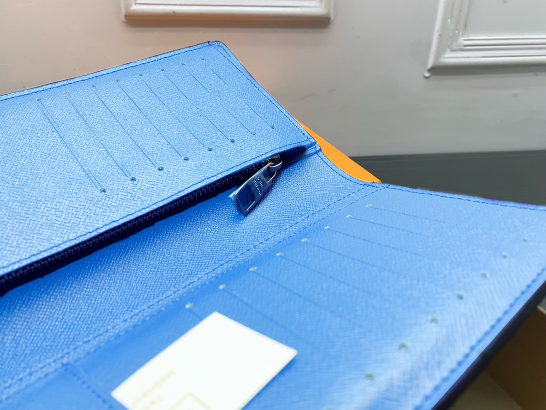Person using the slim leather bifold wallet