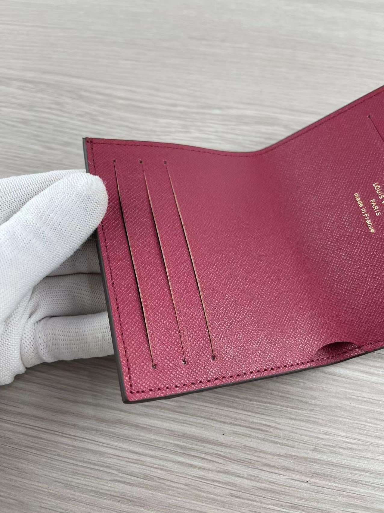 Close-up of stitching details on the leather card holder
