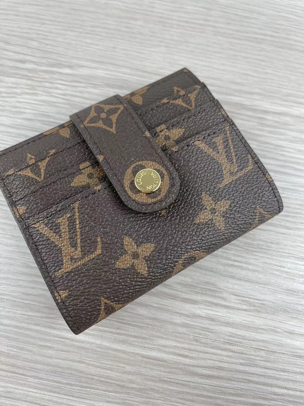 Leather card holder open showing card slots