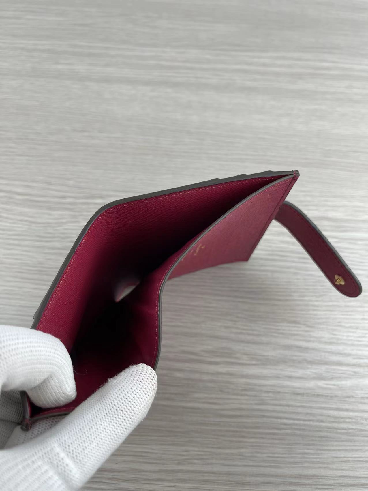 Leather card holder with cards inserted into slots