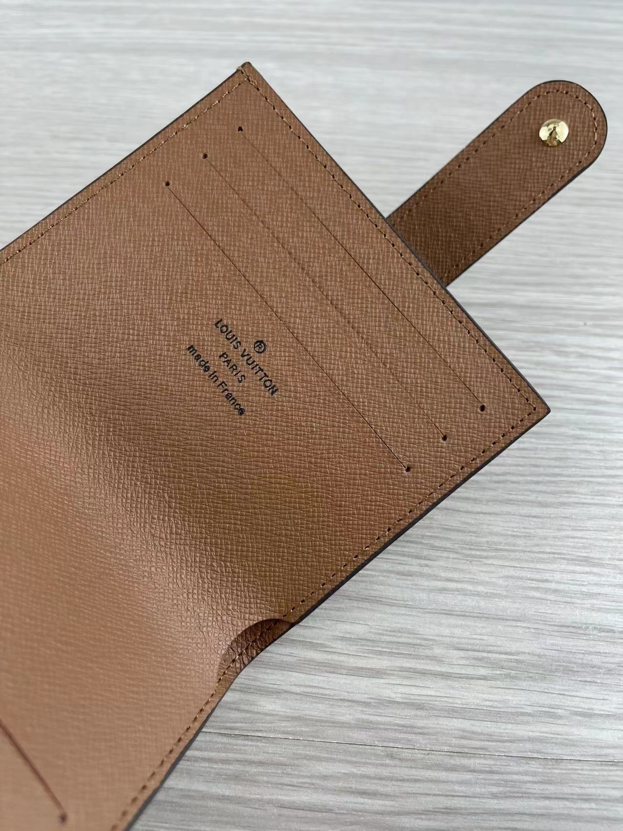 Close-up of stitching details on leather card holder