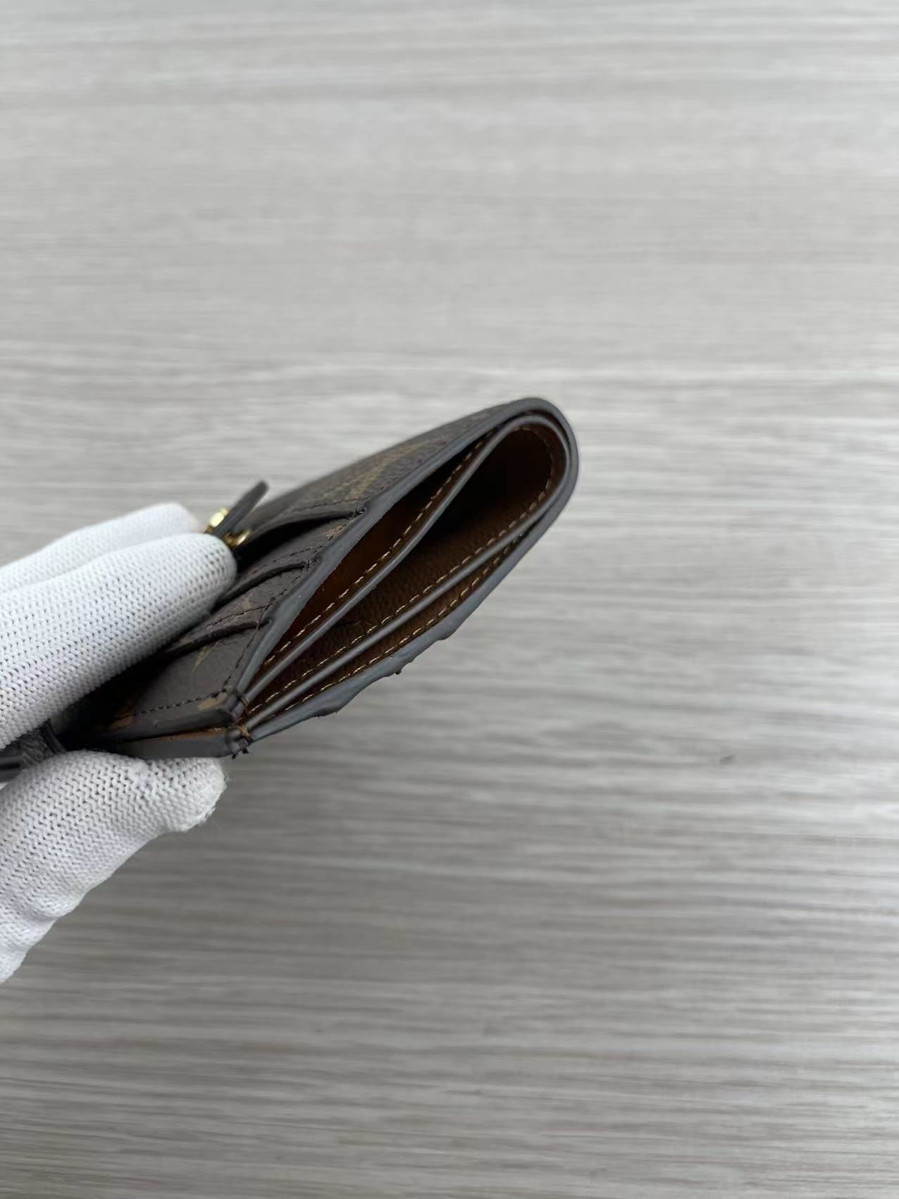 Leather card holder held in hand
