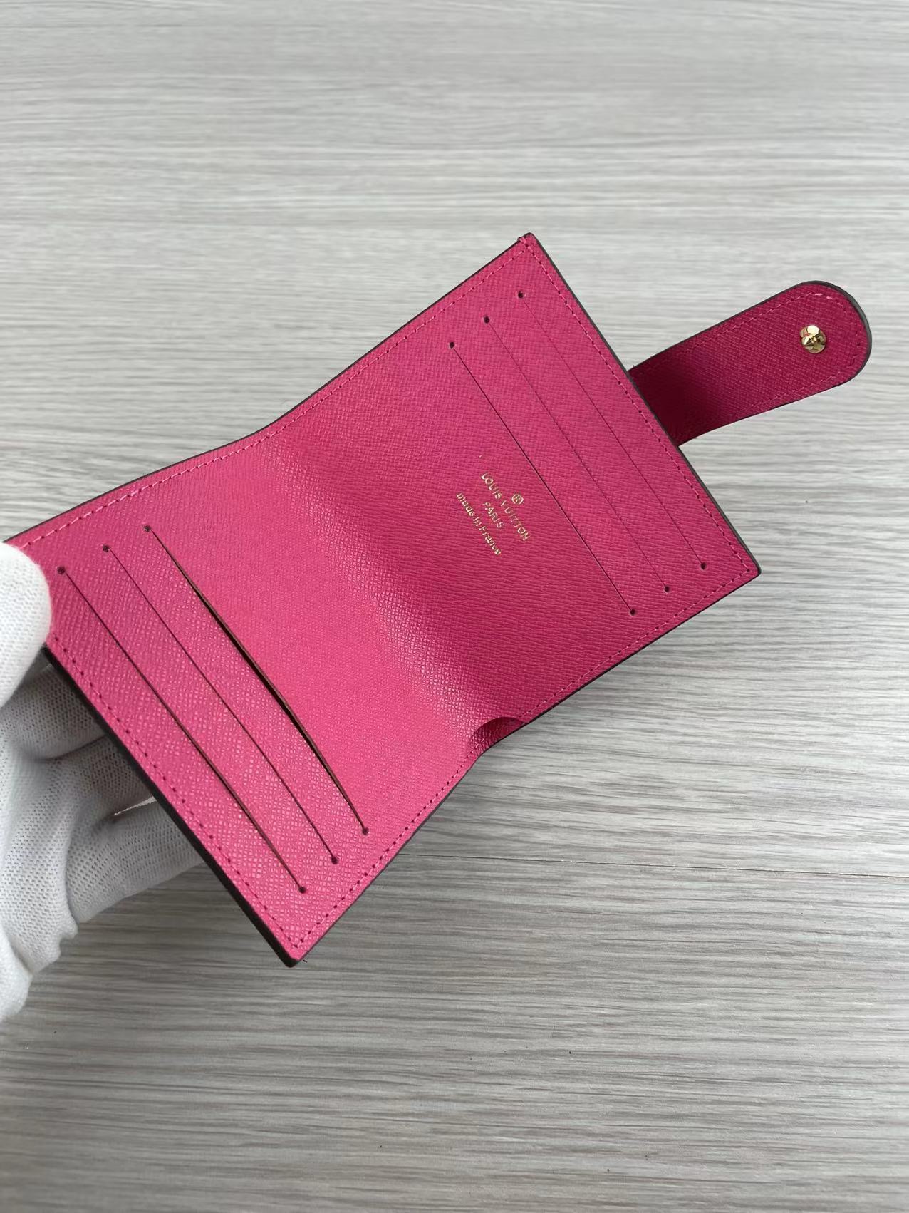 Side profile of pink leather card holder