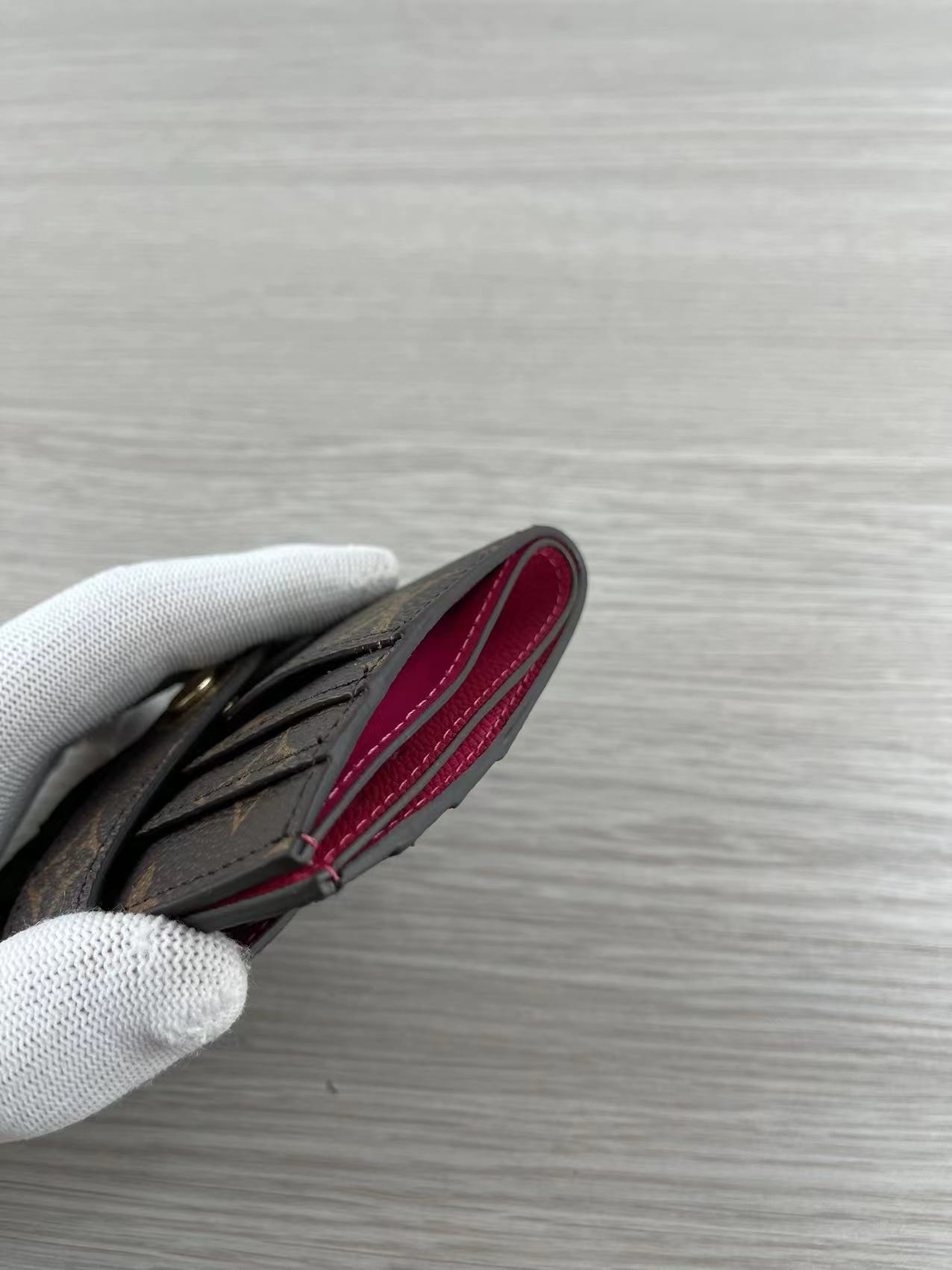 Pink leather card holder from a different angle