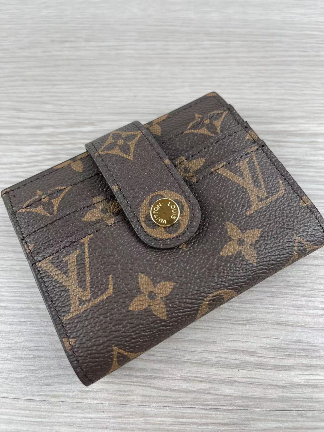 Open view of leather card holder with card slots