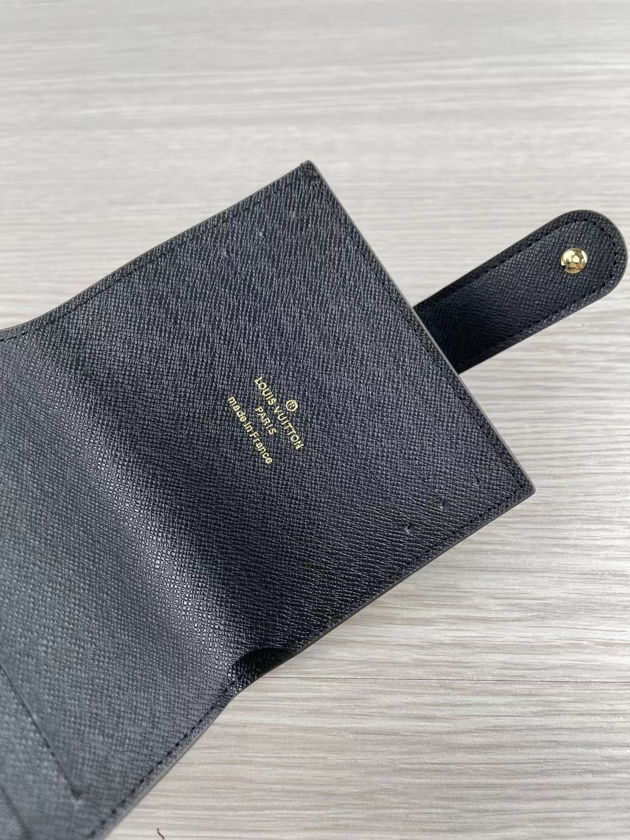 Close-up of stitching details on leather card holder