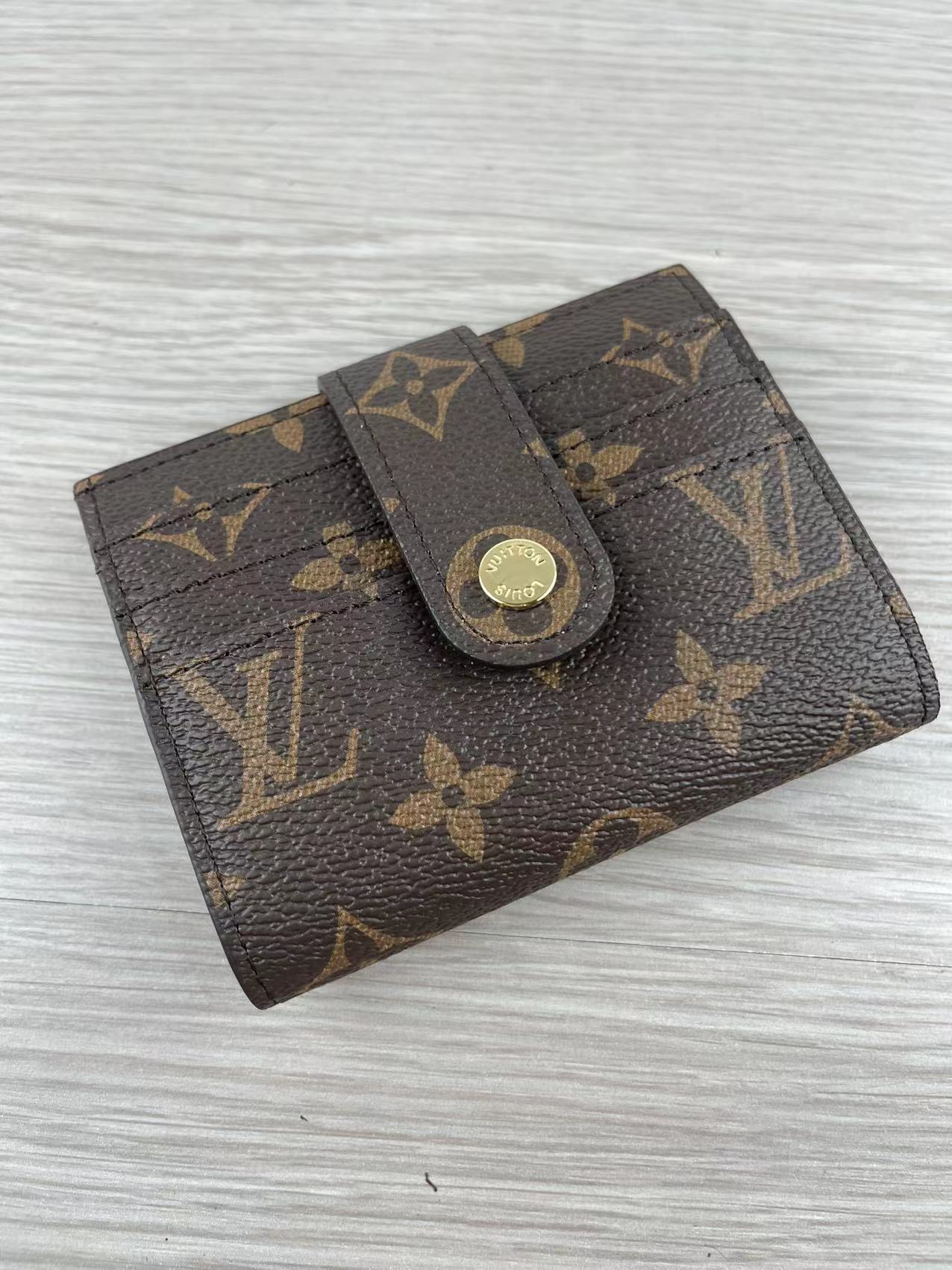 Pink leather card holder open showing card slots