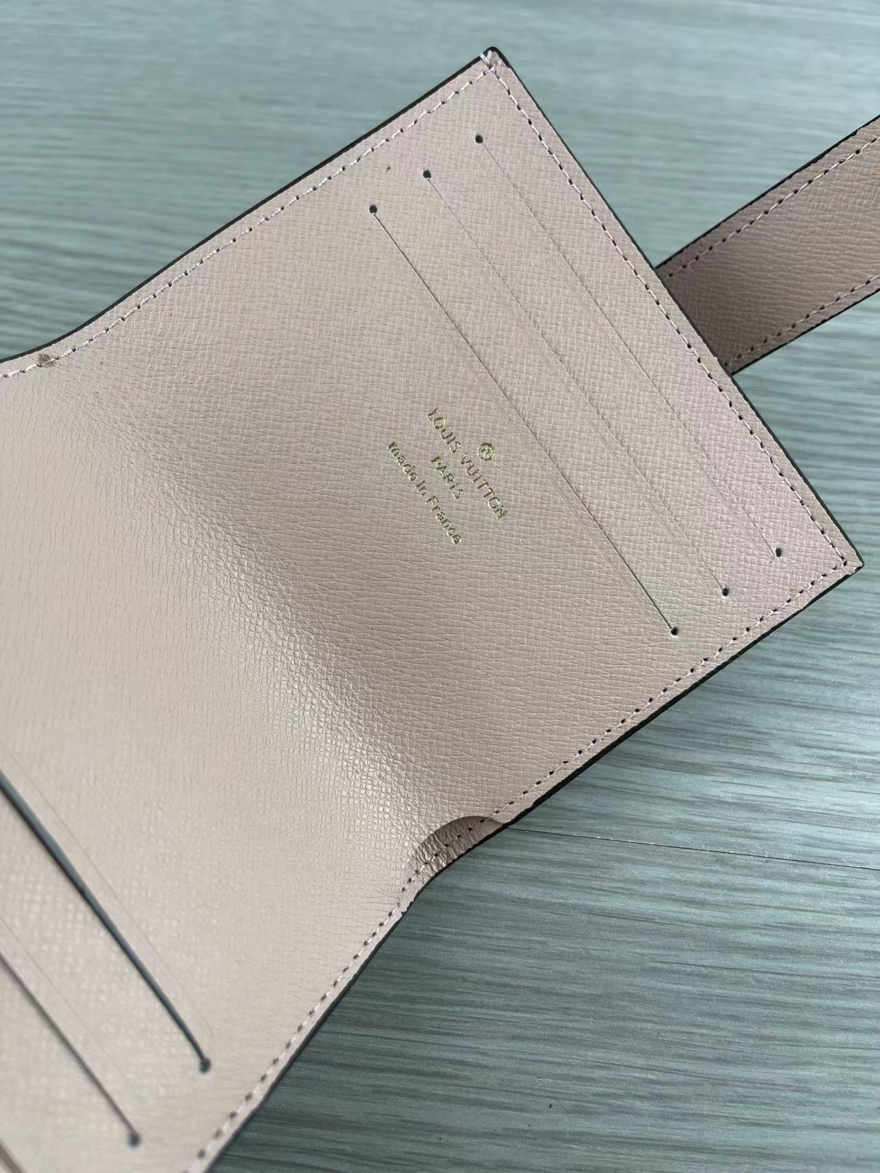 Pink leather card holder side view