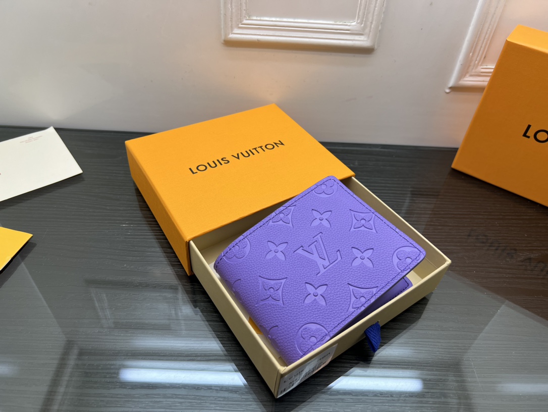 Front view of a minimalist leather bifold wallet