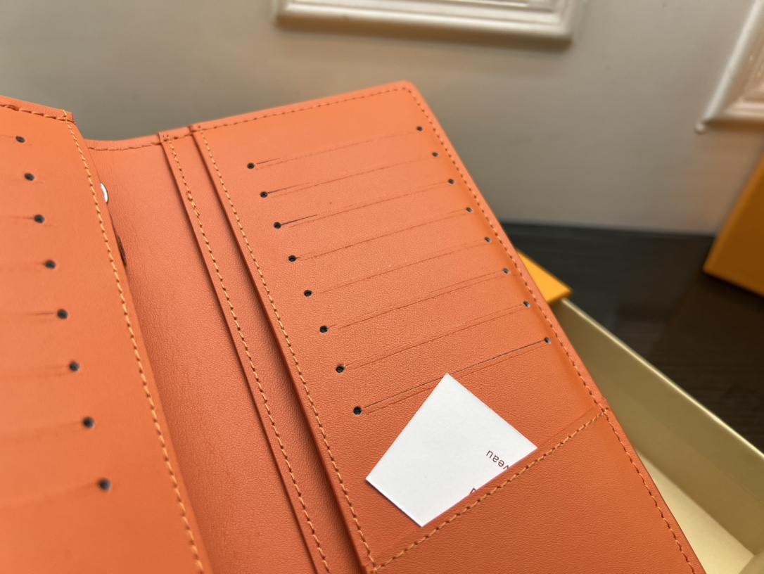 Leather bifold wallet on table