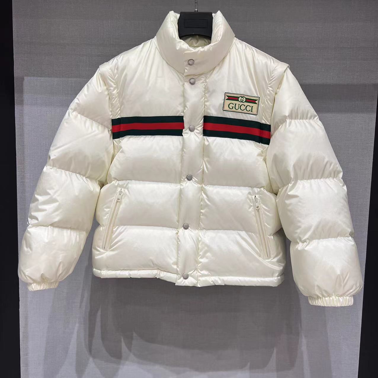 GUCCI striped nylon quilted pilot jacket with 90% white goose down fill, detachable sleeves. Unisex, available in white and black. Sizes: 36, 38, 40, 42.-Big cat