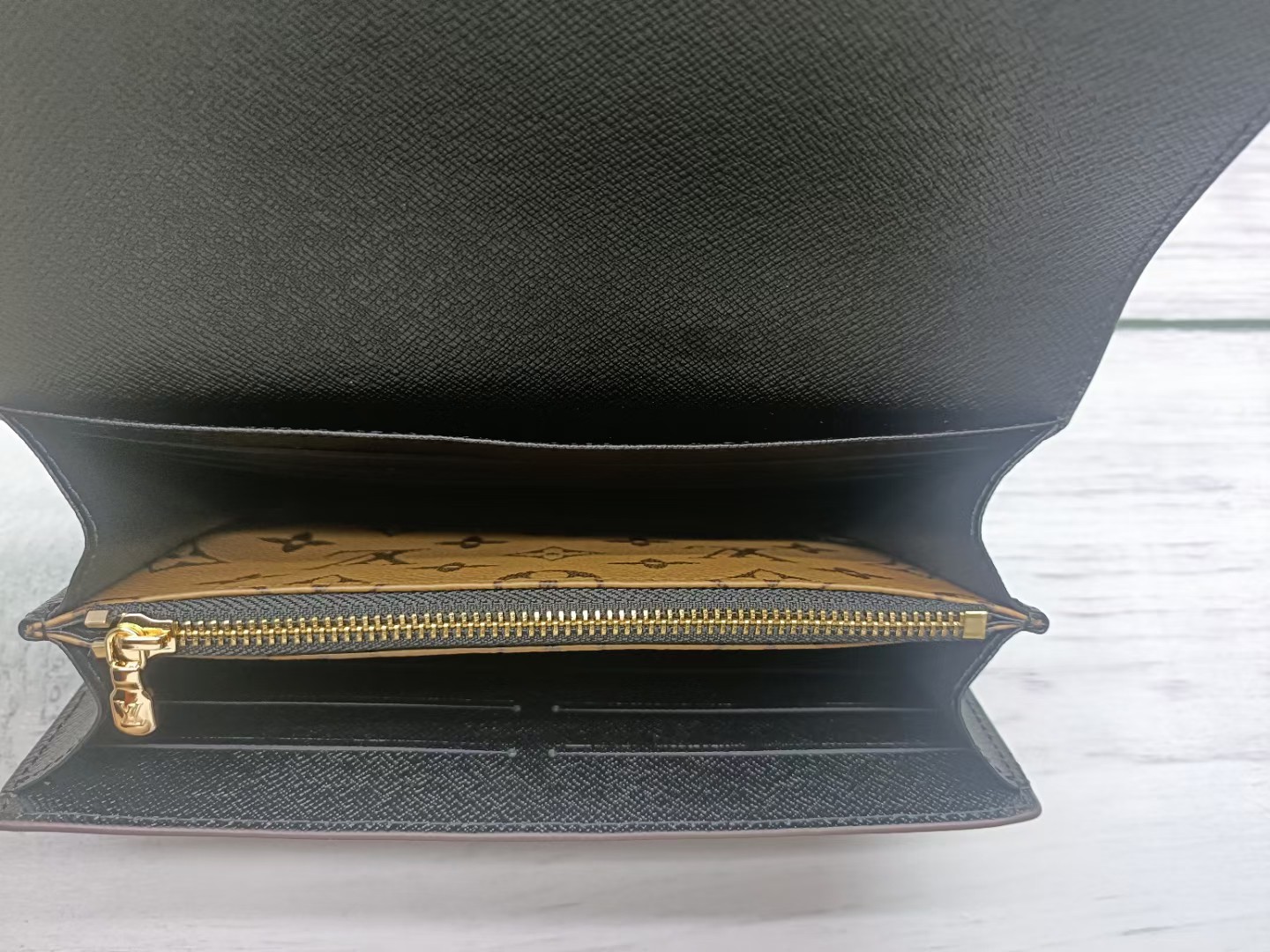 Leather wallet alongside accessories
