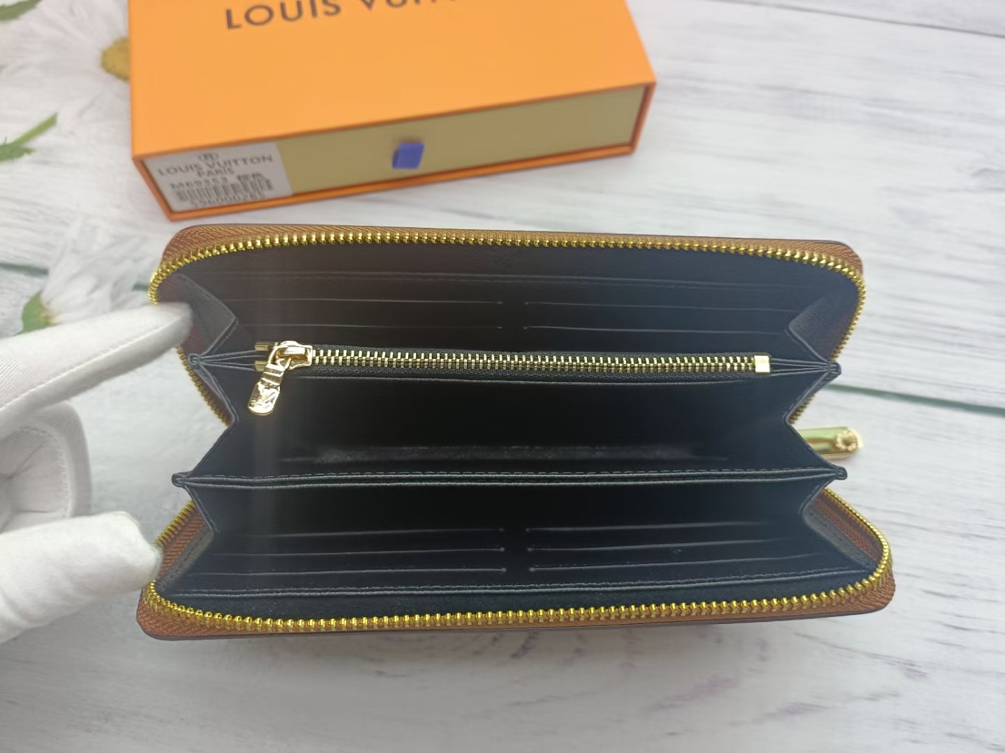 A person holding the premium leather long wallet