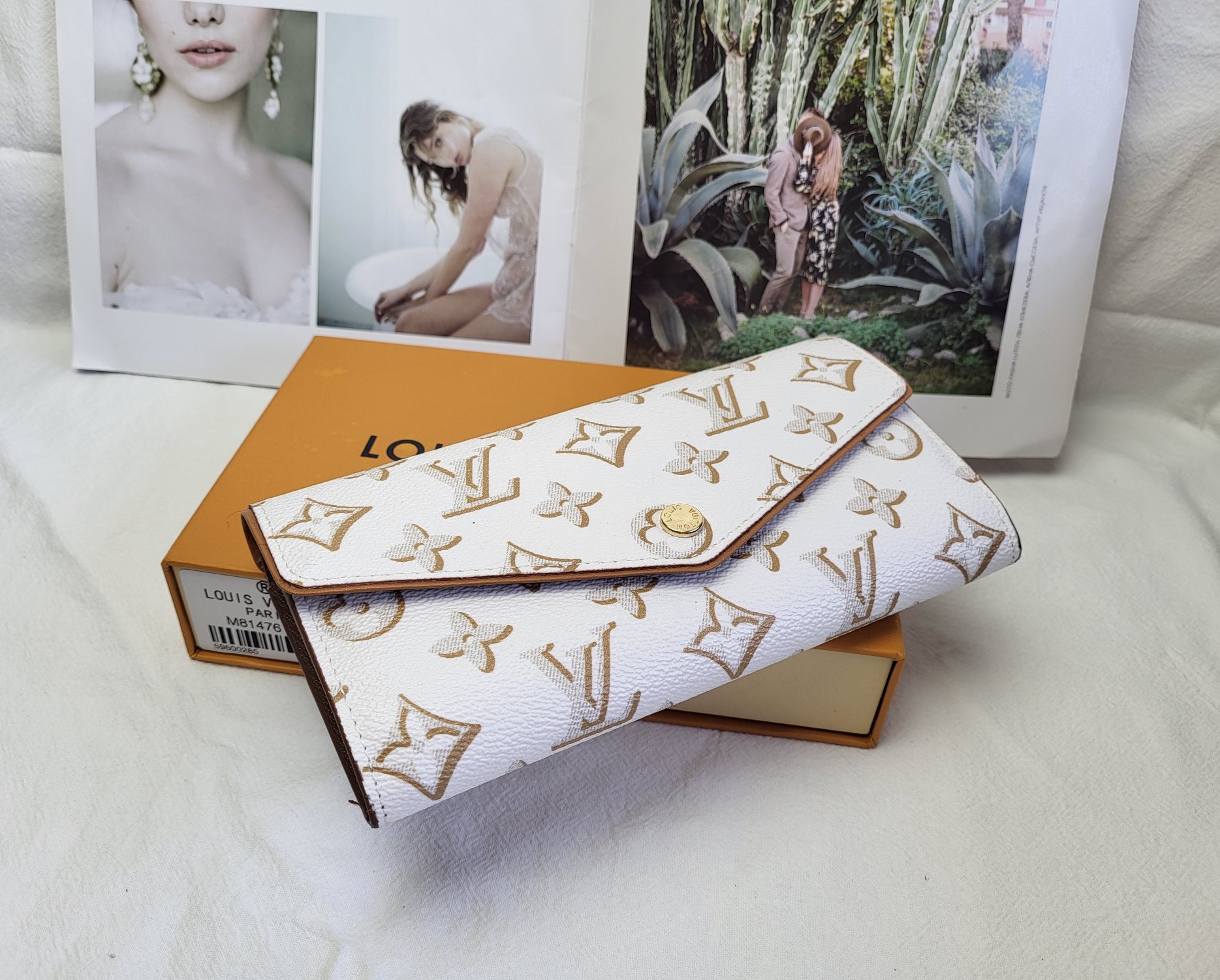 Leather wallet in hand for size reference