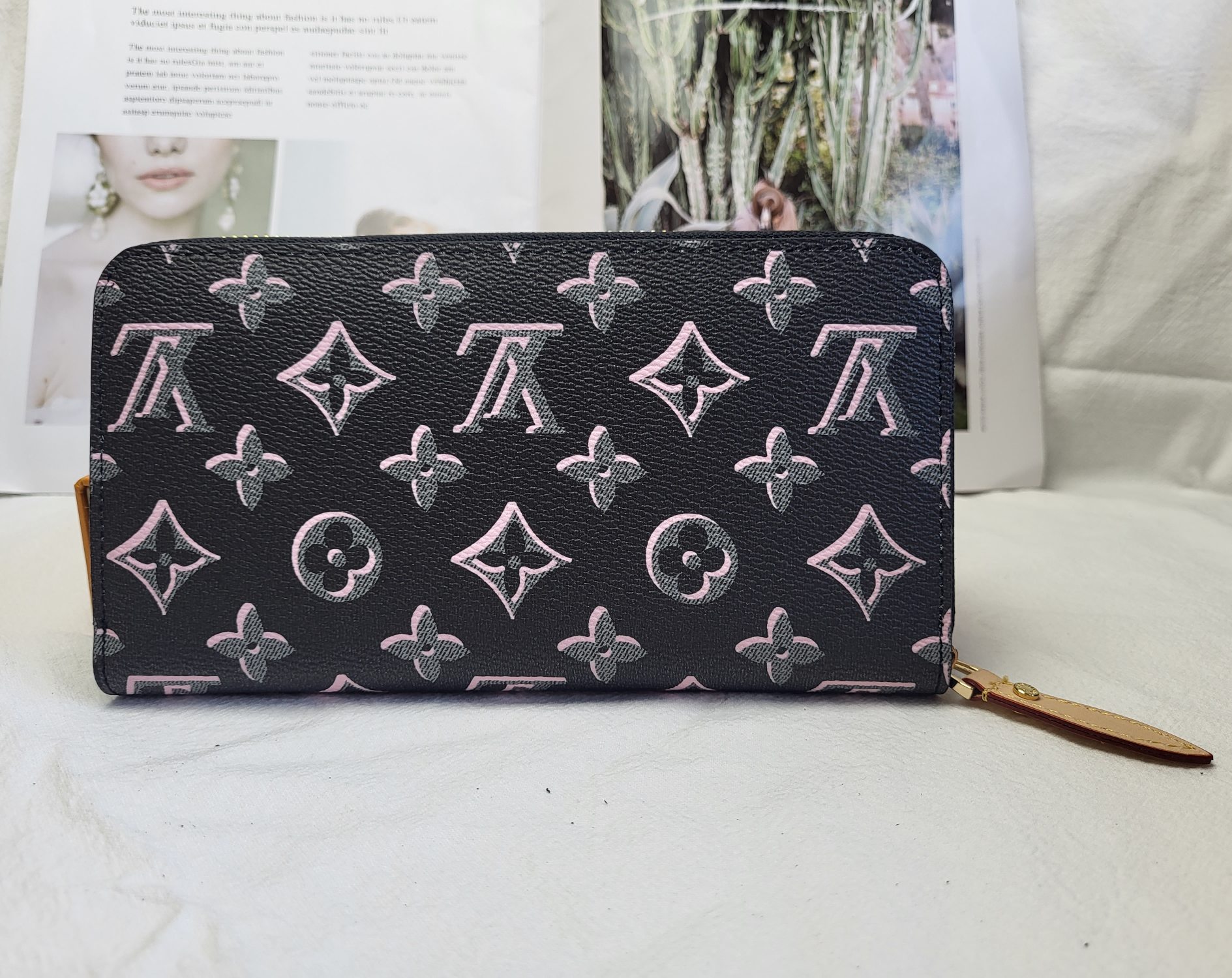 A person holding the luxury leather long wallet.