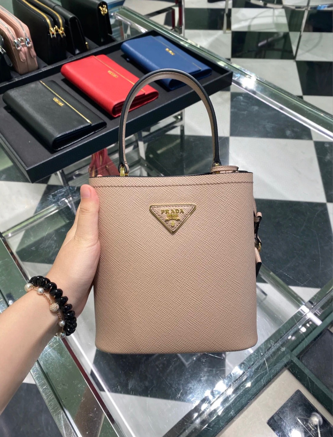 Nude elegant Prada bucket bag