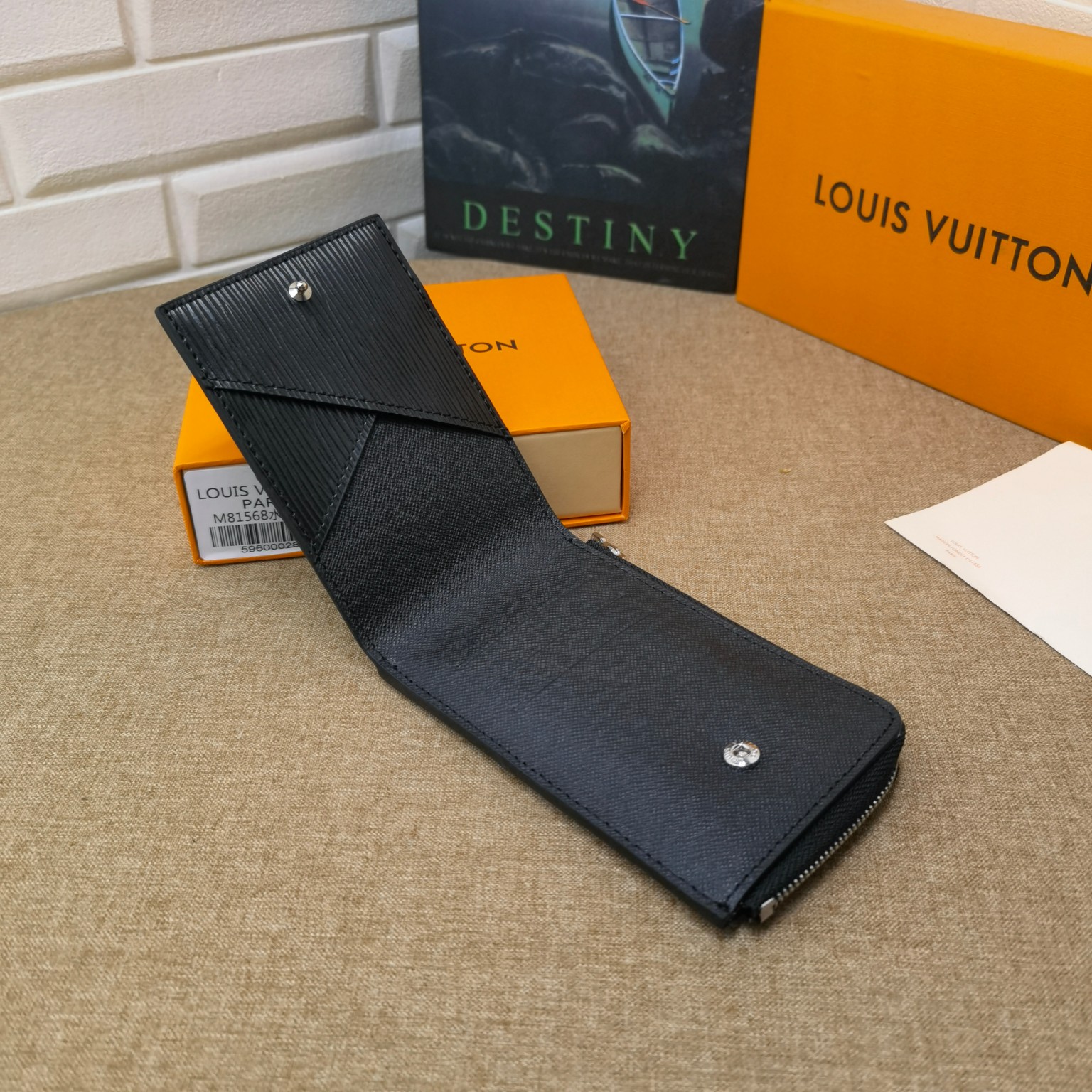 Close-up of card slots on black leather card holder