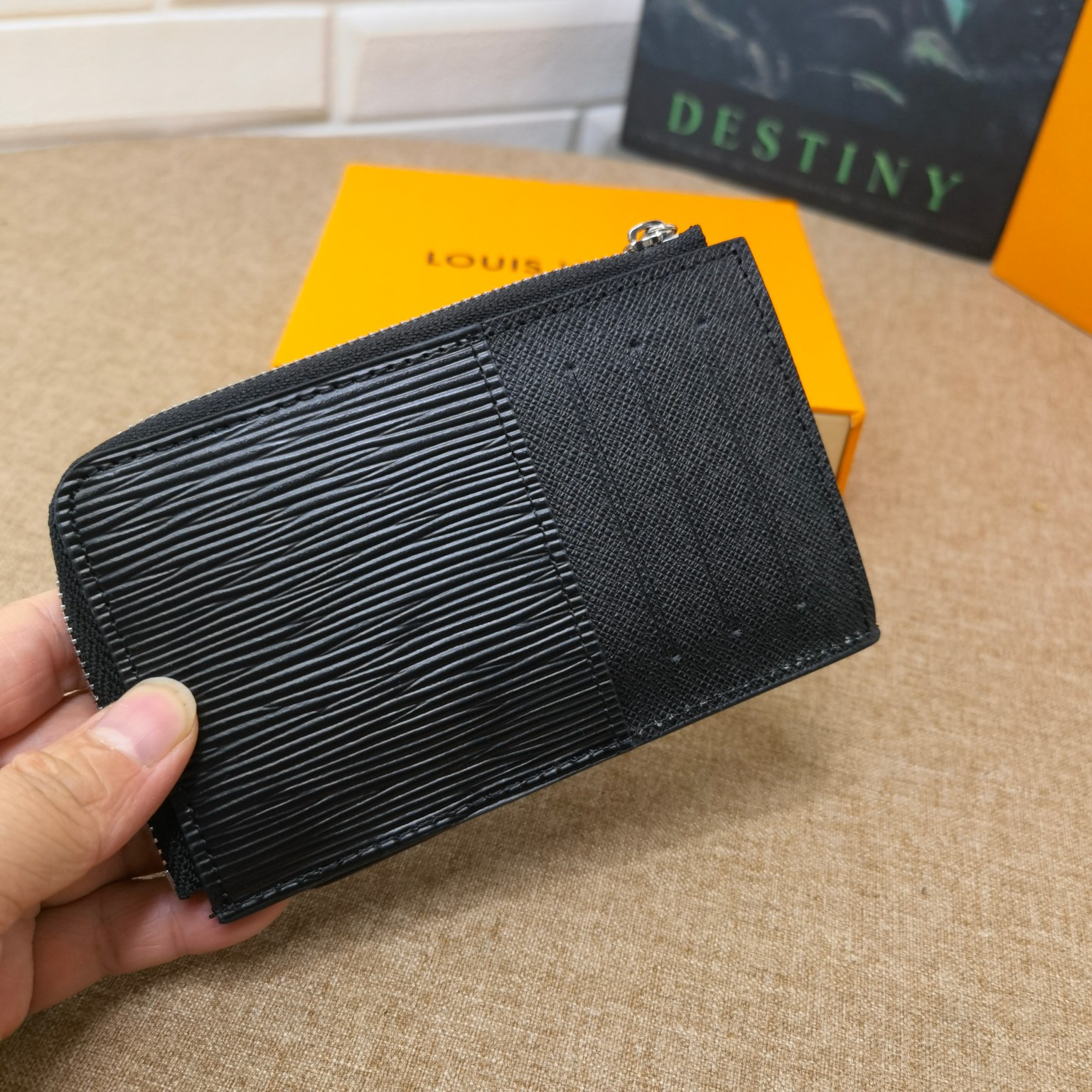 Angled view of the black leather card holder