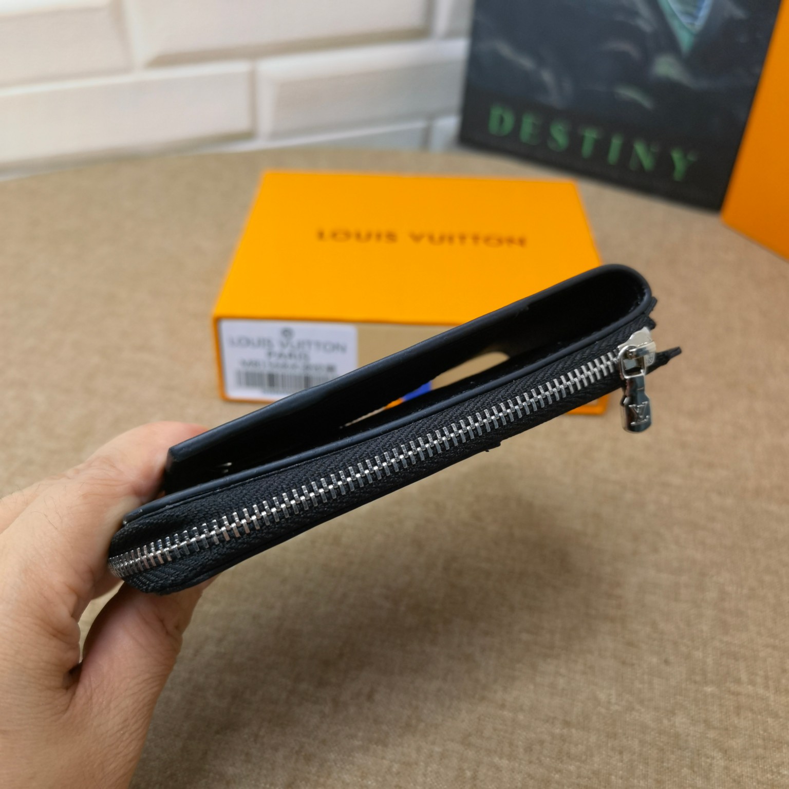Black leather card holder in hand