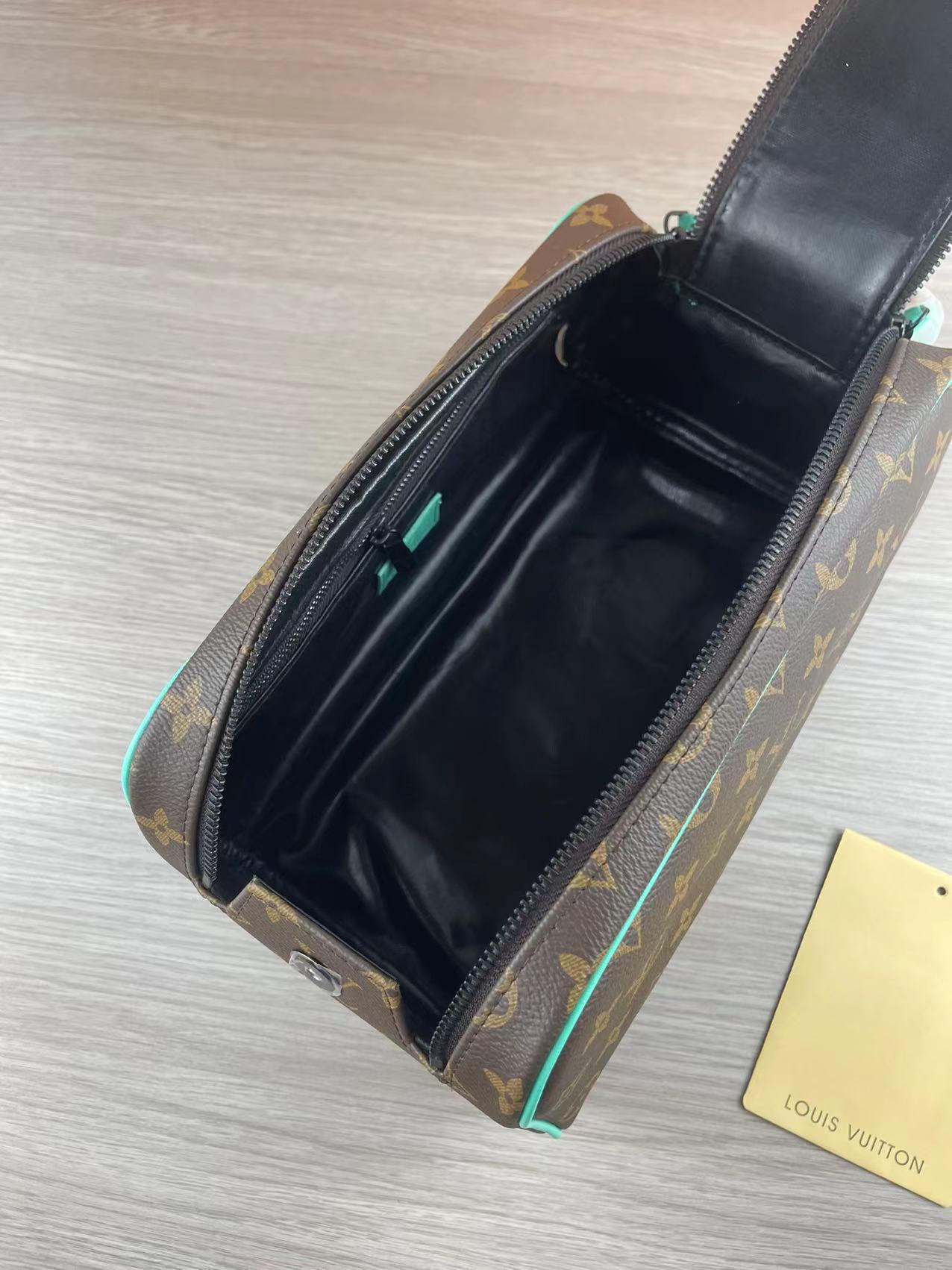 Brown leather wash bag in use