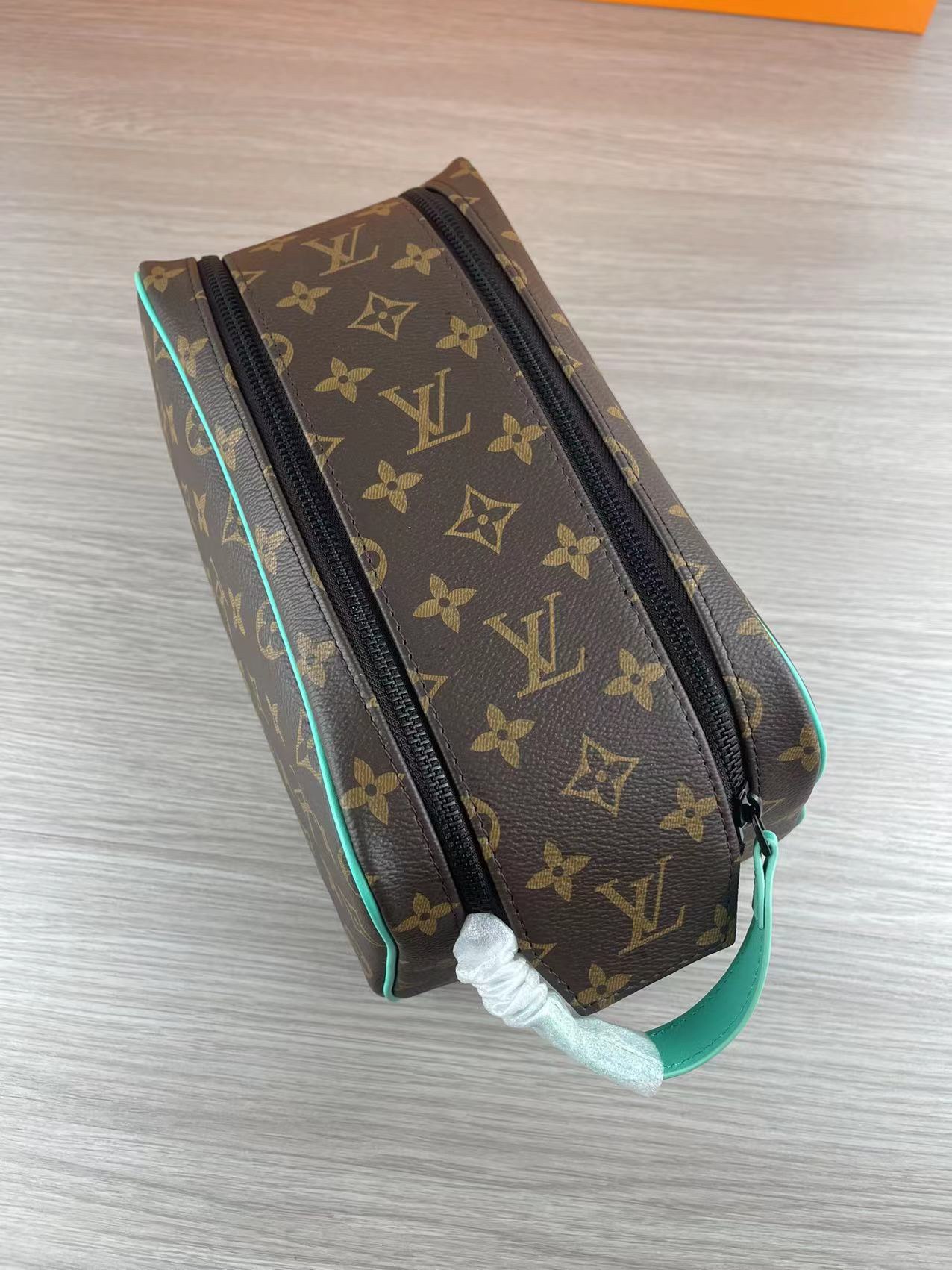 Side view of the brown leather wash bag