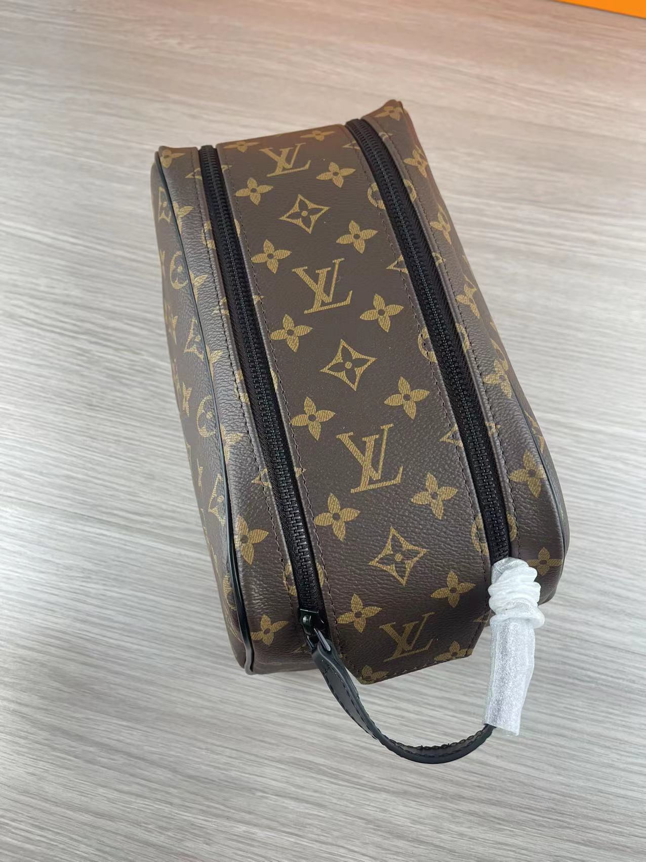 Top view of the black leather wash bag with monogram