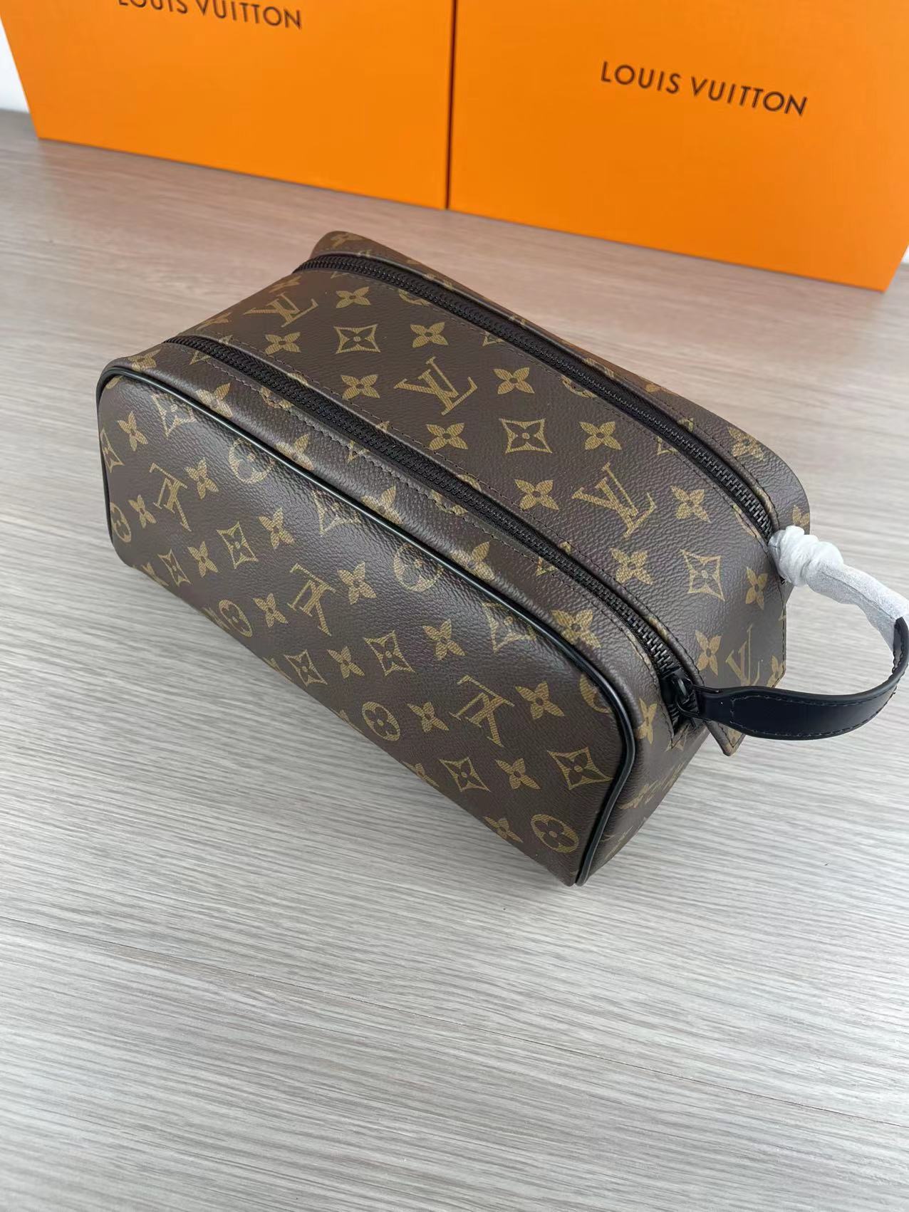Side view of the black leather wash bag