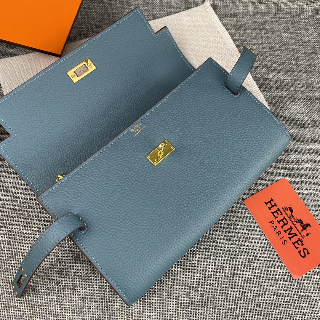 新款凯莉手拿包。
爱马仕HERMES  kelly 包
材质头层牛皮
尺寸：24*14*6cm
型号36