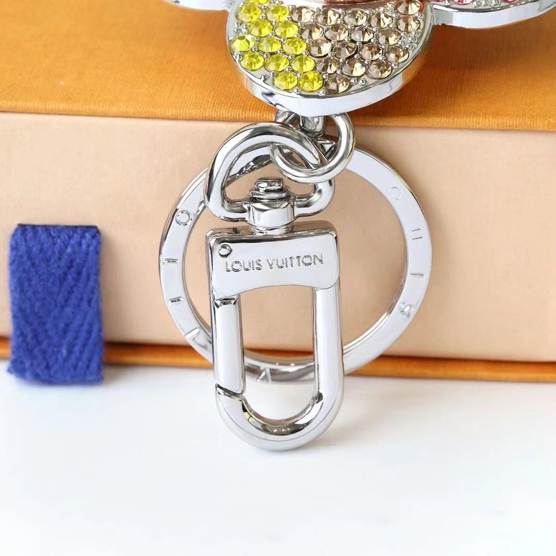 Stylish sunflower keychain held in hand