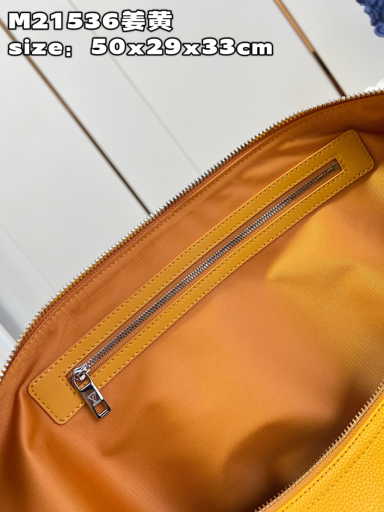 顶级【独家实拍 M21536姜黄】本款 Keepall 旅行袋选用 LV Aerogram 牛皮革塑造经典构型,见证路易威登的精湛皮革匠艺 9