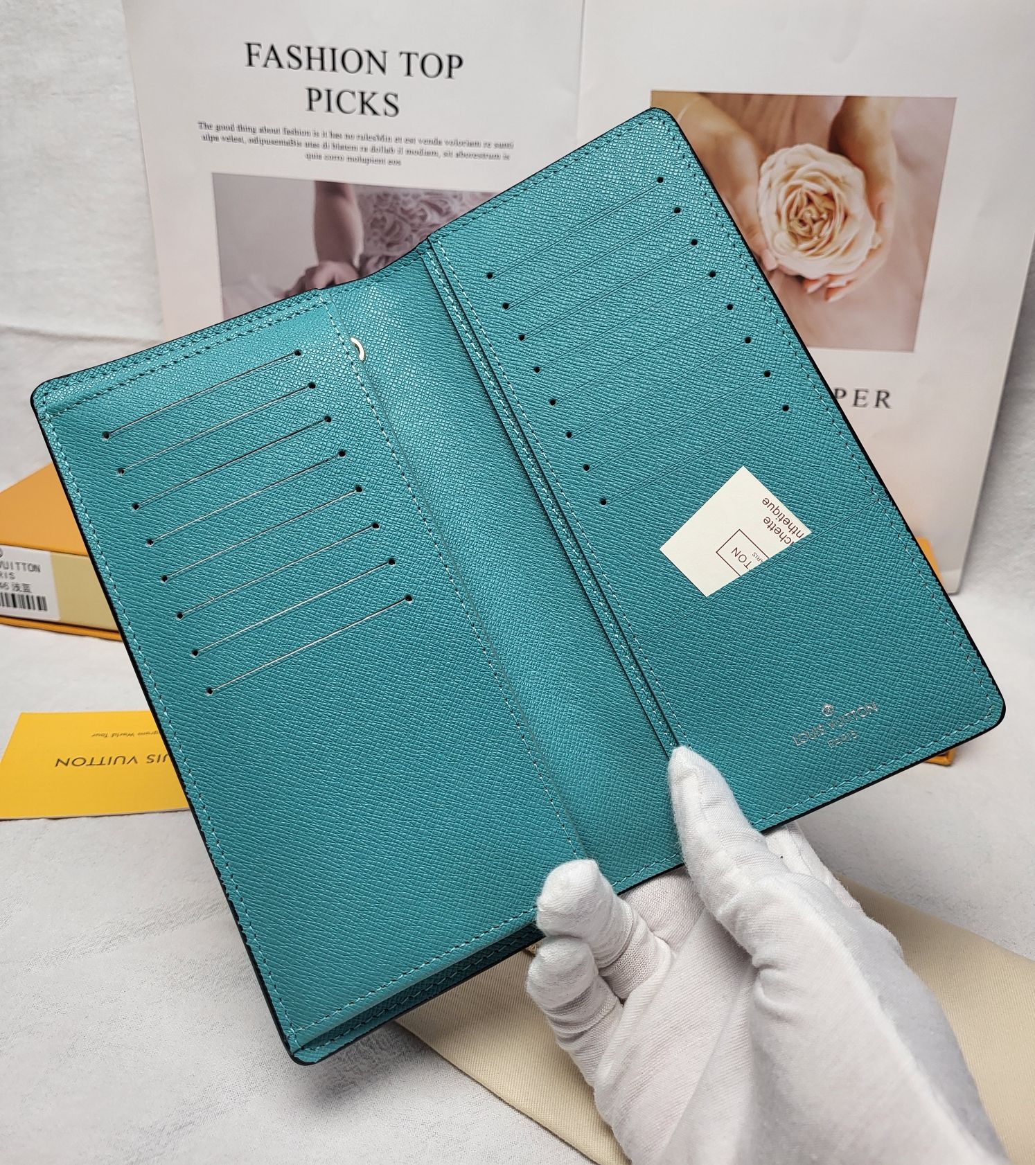 Close-up of brand logo on the leather bifold wallet