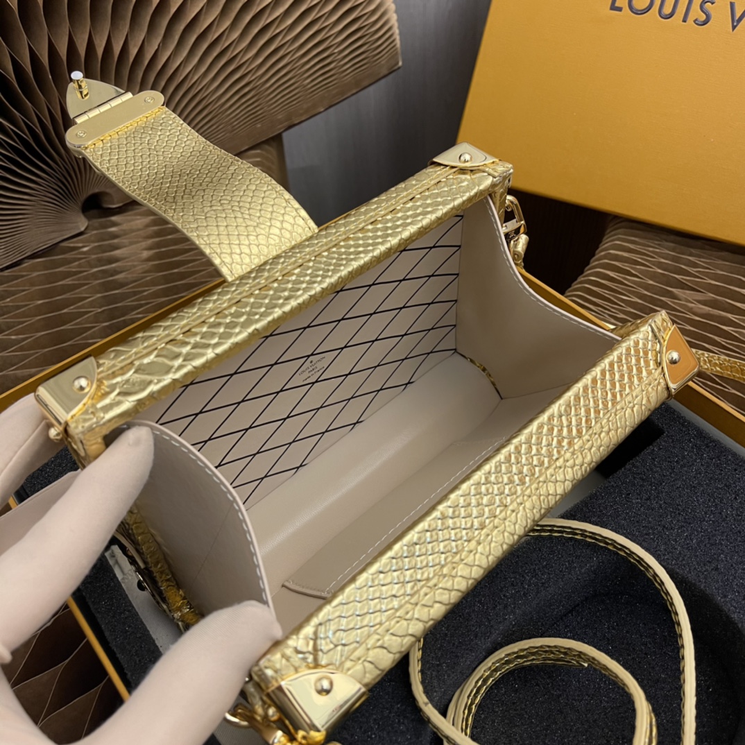 this Petite Malle handbag is crafted from luxurious python skin to - Bag 8