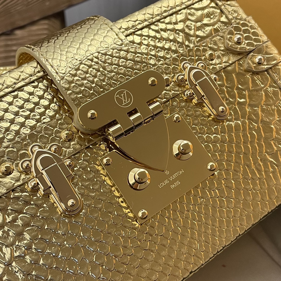 this Petite Malle handbag is crafted from luxurious python skin to - Bag 6
