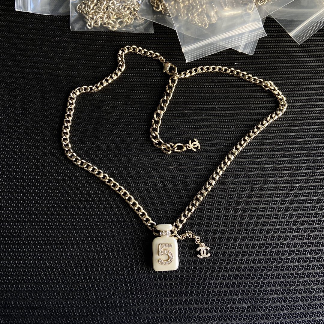 CHANEL perfume bottle necklace white pendant gold chain