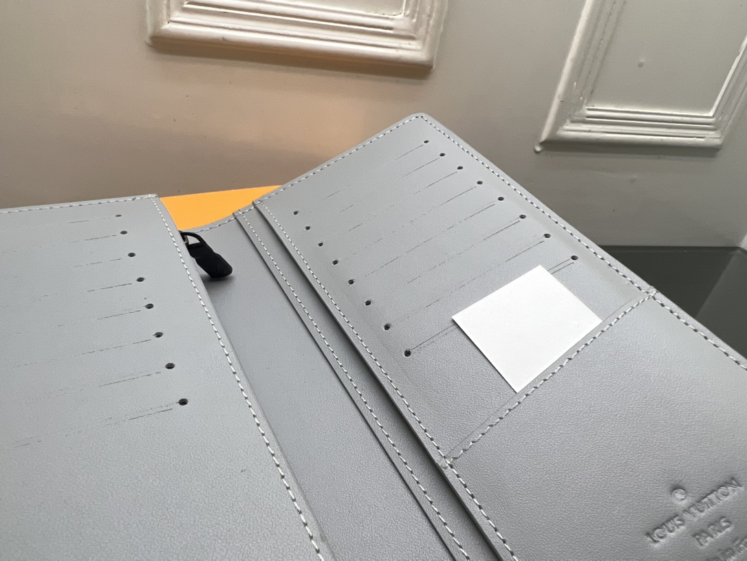 The stylish leather bifold wallet in a lifestyle setting.